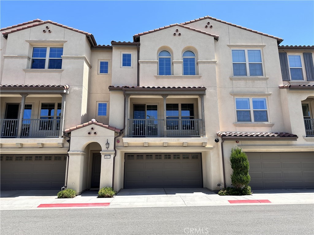 Beautiful turnkey townhouse in the highly desirable Palisades community of Vista Del Verde with a modern floor plan and many extras. This upgraded home has high ceilings, recessed lighting throughout and extra-wide carpeted staircases. The open floor plan on the main level provides a warm and inviting living room with a fireplace, half bath, kitchen, dining area, and a balcony that has partial city views. Custom roller shades and upgraded laminate flooring is found throughout the main level. The gourmet kitchen is equipped with stainless steel appliances, and features a large island perfect for entertaining, quartz countertops, upgraded cabinetry, and a large walk-in pantry. From the dining area, you will find access to the remodeled and professionally landscaped backyard (one of the larger backyards for this floorplan), with artificial turf, drought resistant plants and plenty of room for a table and chairs. The upper level features a large master suite with a deep soaking tub and a separate shower as well as a walk-in closet, along with two additional bedrooms, a full bath, and a laundry room with tons of storage and a utility sink. The carpeted upper level has plantation shutters throughout, with a partial pool view from one of the bedrooms. Boasts an oversized 4-car garage with direct interior access, and is electric vehicle ready with a 240V charging outlet. Additional features include water softener system, washer & dryer, Ring doorbell, 70" flat screen TV, bar stools, outdoor cabinet, backyard BBQ grill, and garage racks and shelving. Home is wired for an ADT alarm system. Community amenities include pool and spa, BBQ picnic area, clubhouse, fitness room, yoga room, tot lot, and miles of walking trails. Located in the award winning Placentia-Yorba Linda Unified School District. Close proximity to grocery stores, dining and entertainment at the Yorba Linda Town Center, the Black Gold Golf Club, and the Yorba Linda Public Library and Cultural Arts Center.