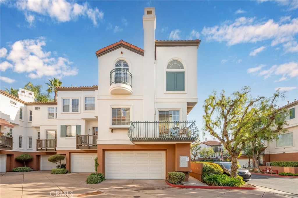 Welcome to your new home, a stylish turnkey condo nestled in the heart of Tustin. This contemporary residence offers a thoughtfully designed interior featuring high ceilings and expansive windows, bathing the space in natural light. The sleek kitchen is complete with modern appliances, quartz countertops and a tasteful backsplash. With 2 bedrooms and 2 ½ bathrooms, including a well-appointed master suite, this townhouse style condo provides a perfect balance of comfort and privacy. Step outside to the patio which is ideal for al fresco dining or relaxation. This tri-level home is an end unit and sits above it’s own 2 car garage so no one is above or below you. Conveniently situated near Tustin Sports Park, Tustin Ranch Golf Club and The Market Place it combines sophisticated urban living with the convenience of a central location to freeways, making it an ideal choice for those seeking a contemporary condo lifestyle in Tustin, California.