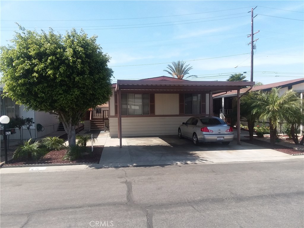 "HOME SWEET HOME" Large Mobile Home Located on Cul-de-sac in Desirable Villa Nova Senior Park , Features 3 Bedrooms, 2 Full Bathrooms, Spacious Living Room, Dining Area with Built-in Hutch, Master Bedroom with Large Master Bath, Central Air and Heat, includes 5 Ceiling Fans throughout the Home, Inside Laundry, and an Office. 2 Car side-by-side Carport, 2 Large Sheds for storage. Low Maintenance Landscape. A MUST SEE TO APPRECIATE! "HURRY WON'T LAST"