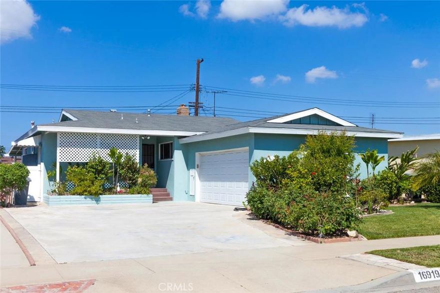 Located on a sunny tree-lined street in Gardena, this single-story home features an attached 2-car garage, 3 bedrooms, 2 bathrooms, and an additional non permitted sun/family room. The open floor plan allows for easy transitions through the home and includes a spacious living room with fireplace, dining area, and open kitchen with eating area, white cabinetry and gas stove with easy access to an inside laundry room. Upgrades  include new laminate flooring, new interior paint, and new carpet in all of the bedrooms. Conveniently located near Arthur Lee Johnson Memorial Park and recreation center, this charming home awaits your personal touches.