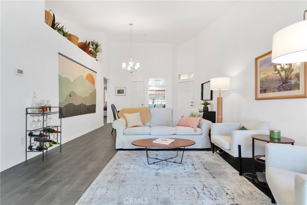 Welcome to this pristine 2 bed 2 bath condo in this sought-after 55+ community. Hop on the elevator and arrive at your upper level condo above public access that provides more privacy, improved views, and general peace of mind. Step inside to find this home has been meticulously remodeled offering a sophisticated vibrant feel! You will appreciate the modern finishes and luxurious vinyl flooring throughout, complementing the updated kitchen and bright and spacious living area with access to your private balcony to enjoy breathtaking mountain views. Indulge in the serene comfort of the primary suite with its attached bathroom, while the additional bedroom and full bathroom provide versatility for guests or an office/den space. Convenience is key with a designated carport and storage area, alongside the option to purchase additional spaces through the HOA. Residents enjoy access to an array of amenities and including a tranquil community courtyard, a refreshing pool and spa, and the security of a gated environment, ensuring both privacy and peace of mind. The residents also appreciate their water included and paid for by the HOA! This condo represents the pinnacle of sophisticated 55+ living, combining modern luxury with community charm.