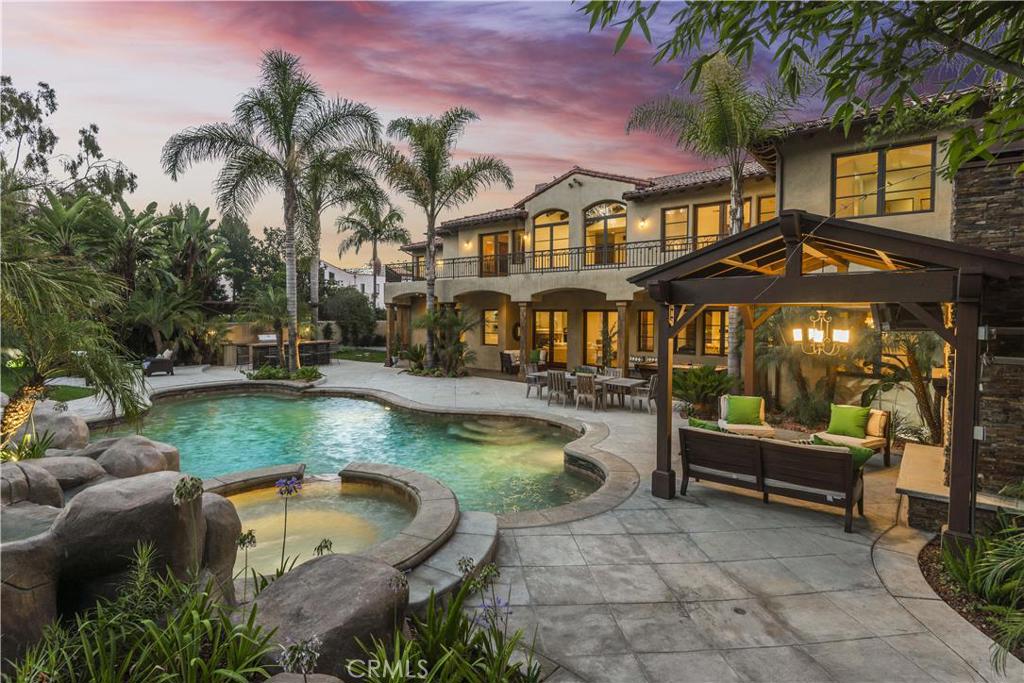 A true rarity in the hub of the Hermosa Beach Sand Section is a stunning sprawling home situated on over a half acre. Need a fantasy resort? A private family sanctuary? This one of a kind property offers all that in addition to providing a warm, inviting, functional home, within strolling distance to the beach, shops, and the city center. Great open floor plan expands to what can only be described as a backyard wonderland. Nestled in lush tropical landscaping is a lagoon-like salt water pool & spa with cascading waterfalls among rocks and a water slide. A zipline is overhead for added fun. Beyond is a sports court and children’s play area. Poolside there is a gazebo with fireplace, built-in BBQ, bar counter, and a fire pit. Guest house has an attached office/play room. Inside the main residence, the atmosphere is fresh and flowing with wide open spaces. Beautiful breakfast room off of gourmet kitchen could also be an art studio/children’s craft area. There's a home theatre & integrated sound system. Master retreat opens up to a large wraparound balcony so that its mistress or master can survey the awesomeness that belongs to her or him. For those who are seeking the beach environment with the luxury of land & privacy, this special place is for you.