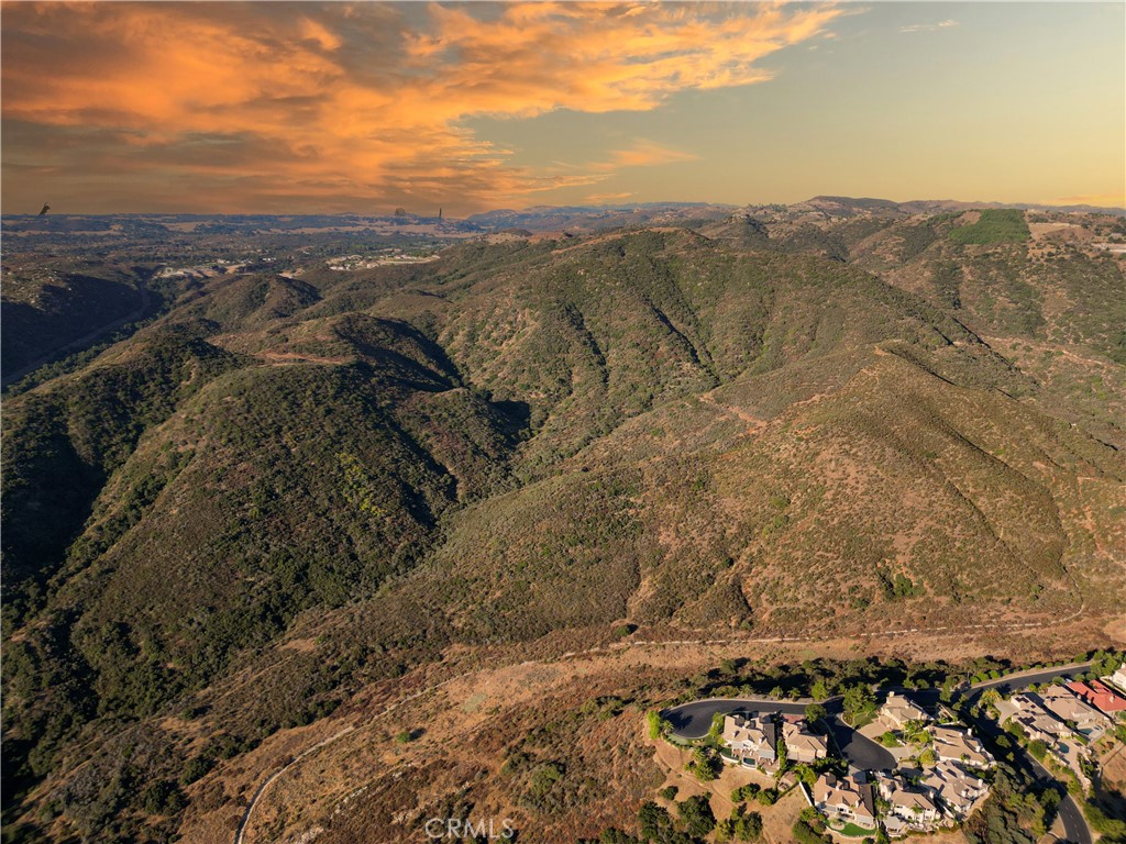 LOCATION, LOCATION, LOCATION! Prime untouched vacant land in a thriving, rapidly developing and massively growing area.
Located in the Temecula Valley Murrieta Foothills nestled right between the luxurious sprawling estate homes of the La Cresta and Bear Creek Communities.
This expansive unimproved property presents endless possibilities for the astute investor, visionary builder, creative developer, or discerning home buyer looking to create their dream oasis.
Property Highlights- Size:70-acres on two parcels. Prime Location: Right on Clinton Keith Rd at base of Santa Rosa Plateau & the entrance to the La Cresta Community, adjacent to Bear Creek Community, across from Fire Station, close to wineries/freeway/golf/shopping/hiking/biking/horse trails/Cleveland National Forrest/Ecological Reserve/schools/ and more. Zoning: RA, providing flexibility for various projects including agriculture. No HOA here. Key Features: creek/mature oak trees/trails on property, views of mountains/city lights/Sant Rosa Plateau.
Potential Possibilities: Finished Estates – Subdivision, development & resale of numerous estate-grade homes, Land Flip – Subdivision, land improvement/entitlement & resale of lots for homebuyers looking to build custom homes or spec builders focusing on semi-custom homes, Agriculture - Fruit and/or avocado trees, or expansive vineyards, Extension of bordering communities or a grand entrance to the Plateau Community, Equestrian Enthusiasts Paradise (ample space for structures/arenas/barns/custom ranch) , County/City Preservation Area, Re-zone to Commercial and provide much needed conveniences to serve the La Cresta and surrounding communities, Personal Dream Estate with room for anything you can imagine (family compound, guest house, pool, private retreat, helipad, tennis/pickleball courts). Whether you are an investor seeking to develop or an individual dreaming of crafting your own piece of paradise – this is a rare chance to manifest your vision.
Investors - with the area experiencing exponential growth, investing in this property presents a chance to capitalize on the increasing demand for quality housing here in Temecula Valley. Seize the opportunity. Go explore the endless potential this rare gem of a property embodies. Invest in your vision today!