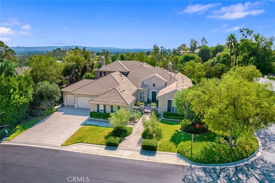 A rare SINGLE-LEVEL floor plan with the builder's upgraded second-floor guest bedroom and a game room. Situated on an impressive corner view lot with immense privacy. The Tustin Ranch Estate home was completely remodeled between 2018-2021. Located behind 24-hour guarded gates, truly amazing grounds with gorgeous landscaping in the community. Breathtaking views of the rolling hills and city lights.  by renowned Standard Pacific with approximately 5,121 sqft of living space on an over 17,000 sqft lot. This elegantly designed 5-bedroom home is the perfect home for large-scale entertaining. Step into the light-infused foyer with 14+ feet height ceiling. Wood plank-like tile flooring flows through the airy first level featuring custom lighting,built-in shelving, elegant French doors, and custom shades & drapes. A gallery that connects all the main living areas. BRAND NEW interior paint, & carpet. BRAND NEW triple zone HVAC system (both condensers and furnaces). Custom audio & visual system (2021). Chef’s kitchen has two-toned custom cabinets, quartz countertops, farmhouse sink, oversized island, Sub-zero fridge, WOLF double oven, 6-burner stove + griddle, wine fridge, 2 sinks, custom floating shelves, designer hardware/fixtures & timeless subway tile full backsplash. MAIN LEVEL MASTER BEDROOM + 3 more bedrooms on the main level. 2nd level has an oversized loft + junior master w/a balcony. 5 beds (4 en-suite beds) and 4.5 baths. Master bedroom has a fireplace and French doors that lead to the backyard.Master bathroom was remodeled in 2021 with full splash marble vanity wall, herringbone flooring, Italian porcelain shower, jetted tub, double chandeliers, vanity area, custom shaker-style cabinets, quartz counters, and designer fixtures/faucets.The powder room has custom wainscoting wall panel, hexagon marble vanity wall, marble sink & designer fixtures. The backyard was completely redone in 2018-2019 w/ the installation of the new pool/spa, an oversized pavilion, multiple seating areas, a bocce ball court, low-maintenance artificial grass, and lush landscaping. Outdoor kitchen has built-in Twin Eagles fridge & ice makers,Hastan gas grill, heater, 2 fans & a fireplace.It offers an abundance of parking, along w/4-car oversized garage. FULLY PAID solar panels. Tuck between Peters Canyon and Tustin Ranch Golf Course near The Market Place. Highly acclaimed Tustin Ranch schools, elementary and middle schools are within close proximity.