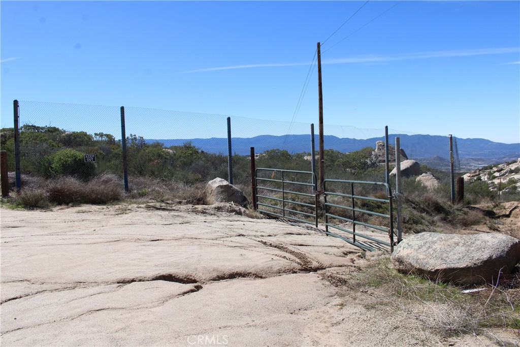 32.48 Acres of beautiful land with WATER WELL. This land is isolated with beautiful views and varied topography. There is a section that is mostly usable/ gently sloping with some cleared areas of the land. There is section of Rock/boulder outcroppings in the middle of the lot. The other side has a blue line/ seasonal creek area with some oak trees and usable land on that side of the lot as well. Bank financing is available with as little as 15% down.
