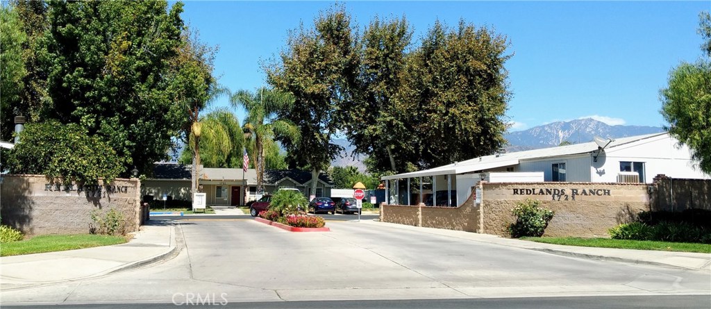 PRICE REDUCTION!!! GREAT REDLANDS LOCATION in an "ALL AGE" Park Community!! This 3 bedroom 2 Bath home features an open floor plan with high ceilings and fans throughout, den/office area, large master bedroom with separate shower/oval tub, kitchen island, and indoor laundry room. JUST ADDED: NEW HARDWOOD FLOORS INSTALLED IN KITCHEN!!! Outdoor features include large carport, storage shed, private yard backing up to Greenbelt, and short walking distance to clubhouse, pool, and playground area. Seller "Very Motivated" and will consider all reasonable offers.
