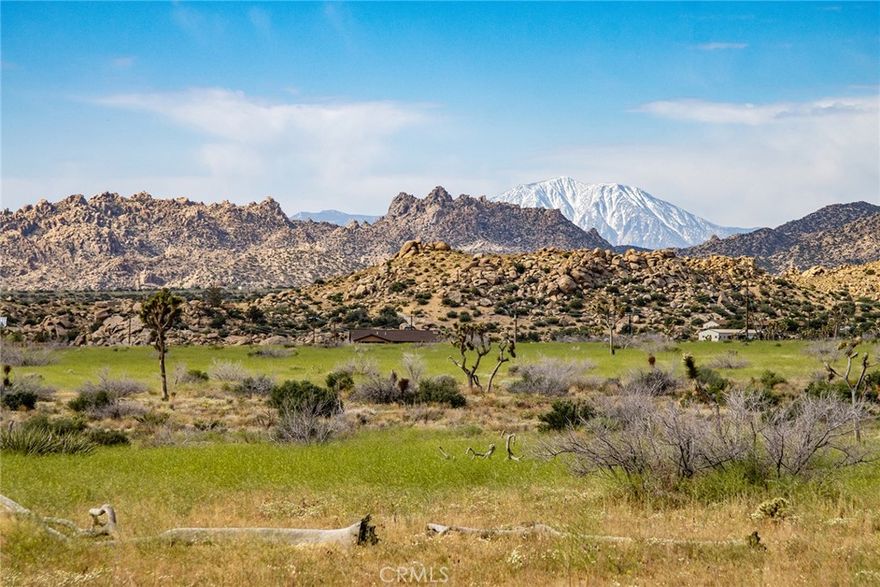 RARE, SPECIAL 5-ACRE PARCEL near intersection of Gamma Gulch & Pipes Canyon Roads. Astounding views of Mt San Jacinto – SoCal’s second tallest mountain. Panoramic views of surrounding ancient buttes – flat-topped mountains – rare geologic formations that occur in few places on earth. Close to Burnes Canyon Road, that climbs to Big Bear Lake through the mountainous forest. Rural, remote feel, but only a short distance to pavement. WELL for water is already dug and in place with pumphouse, casing and pump. Southern California Electric (SCE) power pole is near the corner of the property and an electrical line is strung to the pumphouse. Prior to the late owner passing a few years back, electric was hooked up and the well was fully functioning. As a result, utilities (water & electric) are in place and ready to hook up – extremely rare for this area – buyer to check. This parcel was developed without being surveyed, so there are some irregularities – for example, half of the fenced yard and mobile home on the east side of the parcel were installed on government-owned land and therefore are not officially part of this sale (but buyer could likely have these items demoed and removed to clean up the property if desired prior to building their dream home – or possibly fix up the old trailer for additional housing to use during construction or as your private getaway, as nobody will likely know better – it’s been there for decades as part of this property). A few other outbuildings for storage are on the property that could also be removed prior to development. Government-owned land borders the Eastern AND Northern sides of this special parcel, so your privacy will be preserved on those sides. The other surrounding parcels appear to have already been tastefully developed in a manner that does not inhibit the privacy or utility of this parcel. Easy road access. A true gem of a property – as any agent or buyer will quickly recognize. A little sweat equity will turn this rustic homestead into paradise. NOTE: Green lines demarcating boundaries are approximate, not surveyed. APN: 0454-073-31