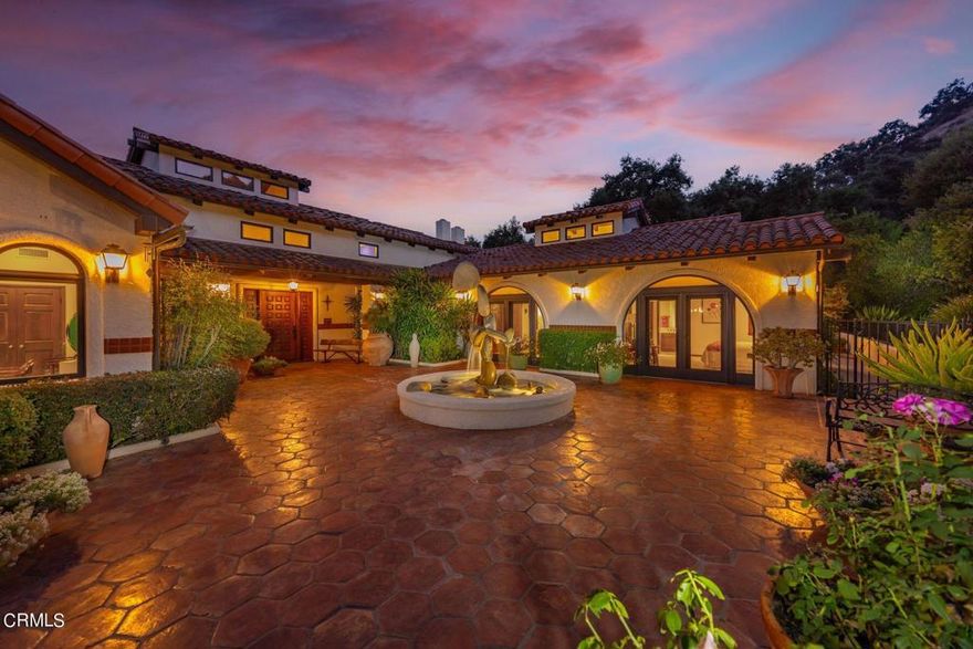 Welcome to Oak Knoll Ranch - a true and authentic Ojai estate nestled on 22 acres (2 legal parcels), boasting breathtaking mountain views and privacy. This luxurious estate property offers a perfect blend of elegance and tranquility, with its stunning architecture and serene surroundings. As you enter through the grand courtyard, you are immediately greeted inside by the striking high beamed ceilings that create an atmosphere of grandeur and sophistication. The spacious 4-bedroom layout (all en-suite) allows for comfortable living and ample room for guests and entertaining. Additionally you have a detached and private guest house, a separate garage/utility building and a Ranch foreman's quarters consisting of 3 bedrooms and 2 baths. The outdoor amenities are equally impressive, featuring a pool, spa, and tennis court for your enjoyment and relaxation. The estate also includes a lemon and apple orchard, fed by a private well. The four-stall barn with tack room allows for Horses or other farm animals, with an arena and a hot walker, ideal for the equestrian enthused. Discover the epitome of luxury Ojai living in this remarkable estate, where every detail has been meticulously designed and crafted to provide the utmost comfort and opulence one could desire.