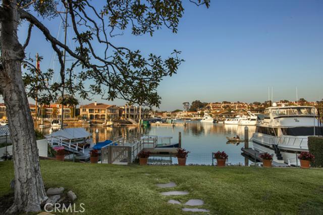 This 8,250 square foot bayfront parcel with 50 feet of frontage offers a unique opportunity to refresh or rebuild on Harbor Island,Newport Harbor's most exclusive private and gated island. This well maintained mid-century home has been lovingly enjoyed by the same family for over 60 years. Harbor Island is comprised of 30 bayfront homes and offer's a private refuge reminiscent of a bygone era. Mature trees and foliage border a sprawling bayside lawn that cascades down to a sandy beach and the bay. An over sized pier and private dock are perfect for the active yachtsman. Desirably situated on the leeward side of the island, away from the prevailing winds, the represents a rare opportunity for the discerning buyer.