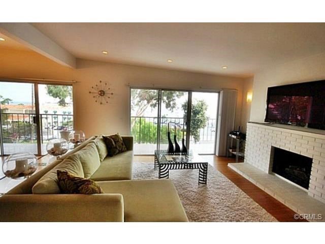 Beautiful remodeled ocean view condo in the perfect location just North of Downtown Laguna Beach. Walk everywhere! Restaurants, Heisler Park, Main Beach, galleries, and shopping are all steps away. Two spacious bedrooms, offered fully furnished. This gorgeous condo features hardwood floors throughout, fireplace in living room, formal dining area, breakfast bar, gorgeous granite/stainless kitchen with gas stove, and luxurious baths. A large balcony stretches across the living room to dining room accessible by two sliding glass doors. One carport space is available in the rear of the building with storage space, along with plenty of metered parking out front for which you can get a city parking permit for use.