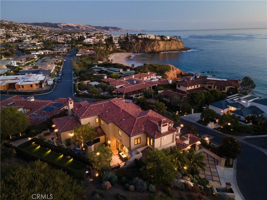 This freshly renovated seaside villa is the picture of perfection. Located in the gated community of Irvine Cove – Southern California’s premier private oceanfront community – its allure is evocative of properties found in the Mediterranean’s sunnier climes. Set upon a gentle knoll at the highest elevation within Abalone Point, the home is light, open, and perfectly captures ocean vistas from throughout. Walls of French doors open to view terraces in every major room. Ocean breezes and the sound of waves on the shore a few yards away create an eminently relaxing environment in which to live and entertain. The home’s 8,600 square feet are ideally arranged for livability, views, and privacy. Outside, magnificent sun-filled gardens overlook the azure waters in the cove below. An event lawn, pool + spa, outdoor kitchen, and entertaining pavilion are the consummate amenities to complement this home and location. The majority of the top floor is occupied by the expansive master suite, which features water and sunset views. The main level includes formal living and dining rooms, a welcoming family room open to the kitchen, a handsomely paneled study, and a breakfast room – all in view of the water. The lower level features a large entertaining room with a stylish bar that opens poolside. The residence also includes a professionally appointed home theater, elevator, and various well-placed service areas. This is a home for generations, and an opportunity never to be duplicated.