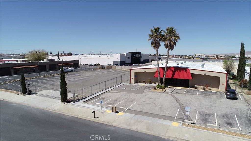 Seize this rare leasing opportunity in the heart of Victorville. Centrally located just off the 15 freeway at the Palmdale Rd exit, this light industrial single-tenant warehouse offers 7,830 square feet of versatile space. With a 30% office-to-warehouse ratio, the property features a well-designed office buildout, multiple restrooms, and a designated break room for your team's convenience. Security is a priority, as the property sits on a fully fenced 20,000 sq ft lot, complete with an automatic gate opener and a security shack. Zoned IPD, don't miss out on this exceptional commercial listing!