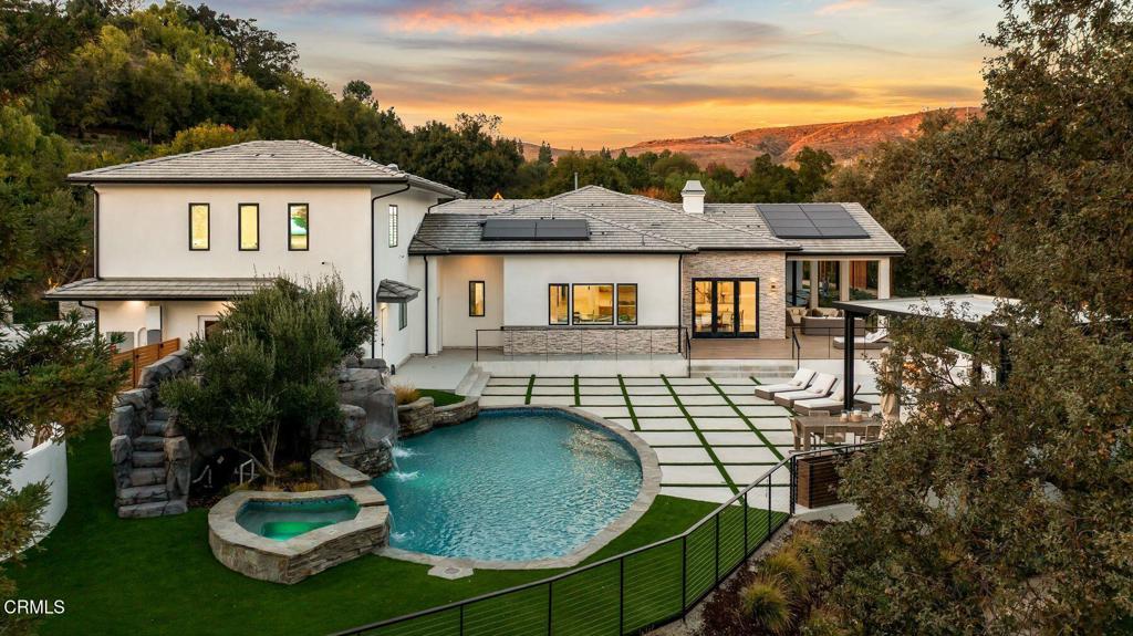 Welcome to 4187 Oak Pl, Westlake Village - a captivating estate where modern luxury meets timeless elegance. Set on a lush 0.98-acre lot, this 6,858 sq ft home offers 7 bedrooms, 9 bathrooms, and a 1,000 sq ft detached ADU/guest house, designed for upscale living and hosting.Manicured landscaping and an enchanting stone pathway create a grand first impression. Inside, soaring ceilings, oversized windows, and curated designer finishes fill the home with natural light and sophistication. The open floor plan balances elegance with comfort, ideal for entertaining or everyday living.The gourmet kitchen features top-of-the-line appliances, sleek cabinetry, and an expansive island, while the primary suite offers a spa-inspired bathroom, walk-in closet, and private balcony. Luxurious en-suite bedrooms provide privacy for all.The ADU/guest house, with its private entrance and refined finishes, is perfect for guests or a retreat. Outdoors, enjoy tranquil gardens, a sparkling pool and spa, al fresco dining, and a fire pit.This estate defines luxury in one of Westlake Village's most prestigious neighborhoods.