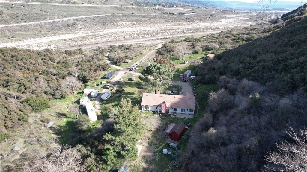 Prime Land is ready for you to unlock the potential of this expansive 40-acre lot in San Bernardino! This rare offering presents a 3+2 house, with new windows and exterior textures and paint. Oversized Solar Panel Incredible opportunity for investors, developers, or those seeking a private retreat. It is 40 acres of versatile land, providing ample space for residential, agricultural, or commercial development. Zoning is R-R and can change the zoning on anything over 5 Acres. Ideal for a variety of uses—explore possibilities for single-family homes, multi-family units, or commercial projects. Enjoy breathtaking views and the tranquility of open space, perfect for creating your own paradise or investment opportunity. Utilities are connected and in proximity to expanding utilities, making development easier and more efficient. This expansive land is a blank canvas awaiting your vision! Contact us today for more information and to schedule a viewing of this incredible 40-acre property at 16397 Cajon Blvd. Don’t miss out on this unique opportunity! Close to the Railroad tracks. There are two entrances from the main road to get to the property. Glen Helen Rd and Kenbrook Rd off Cajon. Just notified there are plans for a shopping center approx 30 acres in the area.