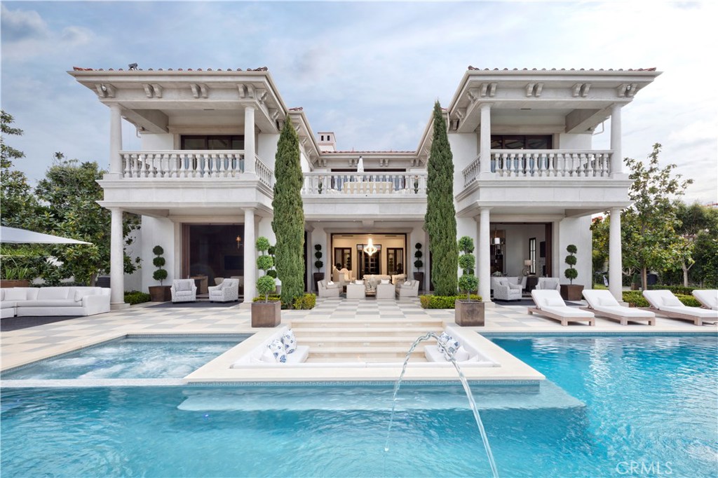 This is one of the most admired custom estates in Crystal Cove, situated on more than 1/2 acre with prime ocean, harbor and Catalina views. Completed in 2017, 18 Coral Ridge - developed by Jim and Spencer Sylvester of the renowned Sylvester Team - enjoyed one of the most buzzed-about introductions within this prestigious community. The 12,628 s.f. residence is a stunning achievement in classical-meets-transitional style. A rare 35’ height allowance creates bright, airy interiors with soaring ceilings that open through 11 sets of massive custom pocket doors to sprawling grounds comparable to those of a five-star boutique resort. The magnificent home spans 6 bedrooms, 11 baths, with an ultra-luxe master suite with breathtaking views of the ocean and harbor. Clad in the finest bespoke, imported finishes, the home features every imaginable amenity, including an indoor golf simulator, billiards room, theater, 600-bottle wine cellar, and 3000 s.f. garaging for 8-10 cars. The grounds offer a 70-foot pool, spa, fire pit, poolside cabana with built-in BBQ, bar seating, built-in TV, and outdoor bath, a putting green and a garden chess set. Enjoy the 24-hour guard gated community’s amenities including clubhouse, pool, fitness + tennis facilities and more.