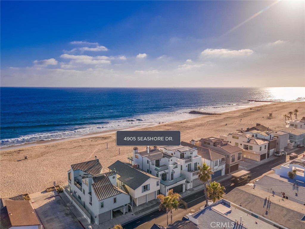 Ideally located on one of the most highly coveted strands of Oceanfront in Orange County, this thoughtfully appointed home is the epitome of a perfect beach house!
Built in 2015, every inch of the property was designed for your enjoyment using the utmost quality of craftsmanship and material. This Cape Cod/Transitional beach home encompasses 3 bedrooms and 3.5 bathrooms, a third level living room (which could be a 4th bedroom) and a third level deck offering magnificent panoramic ocean views.
The open concept has been designed to create the perfect entertaining space and the ultimate indoor-outdoor living experience. Upon entry, the main living area offers sweeping Ocean views and a cozy fireplace. Embrace indoor-outdoor living with disappearing sliding doors and enjoy your beach front patio on the sand. The Chef’s kitchen offers a center island, top of the line Sub Zero appliances, Thermador Professional stove, two additional refrigerator drawers, an ice maker, and custom-built cabinetry.
Ascend to the 2nd story to find the luxurious master suite with breathtaking ocean views. The spacious master bath includes dual vanities, walk-in shower, and an expansive walk-in closet. Down the hall are two spacious bedrooms - each with its own outdoor patio views. One full bath and a laundry area complete the second level.
The third floor boasts a bonus room with a full bathroom (could be 4th bedroom), a covered dining area with a full outdoor kitchen including Wolf BBQ, refrigerator, ice maker, dishwasher, sink and of course, a spacious outdoor deck with fireplace and unobstructed ocean views.
No expense was spared with this dream home. Warren Christopher White European Oak wood floors used throughout the entire house, Fleetwood sliding doors, whole house Sonos audio system, central vacuum system, two car garage with large storage cabinets, Electric car charging capability, outdoor shower and so much more to make this house the one you’ve been waiting for! Between the private patio, the balcony and the 3rd story deck it's an additional 1115 sq ft of private outdoor living space with unobstructed ocean views you can enjoy.
This stunning beach home offers the ideal combination of views, luxury, privacy, and accessibility to all the endless entertainment delights that Newport Beach has to offer from the Newport Beach pier, to world renowned Fashion Island and South Coast Plaza.