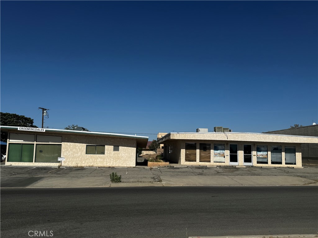 This property is potentially the best commercial buy in the desert, featuring two buildings just off Highway 62 on Church Street. The first building spans 2,800 square feet and is partially rented, with half of the space currently vacant. Originally configured for six rental units, each with its own electric meter, the seller has reconfigured the building into four units, though it can easily be reverted back to six units if desired. This building also includes a roll-up door at the back.
The second building is fully rented and has been previously used as a hair salon but is now a dog spa. Both buildings have two bathrooms each and share a spacious parking lot with approximately 25 spaces, accessible from both sides. The property is conveniently located near medical offices and shopping centers, offering numerous possibilities for use. Where else in town are you going to get a building of this size at such a great price? Owner may Carry with approved terms. make time to see this versatile property for yourself today!