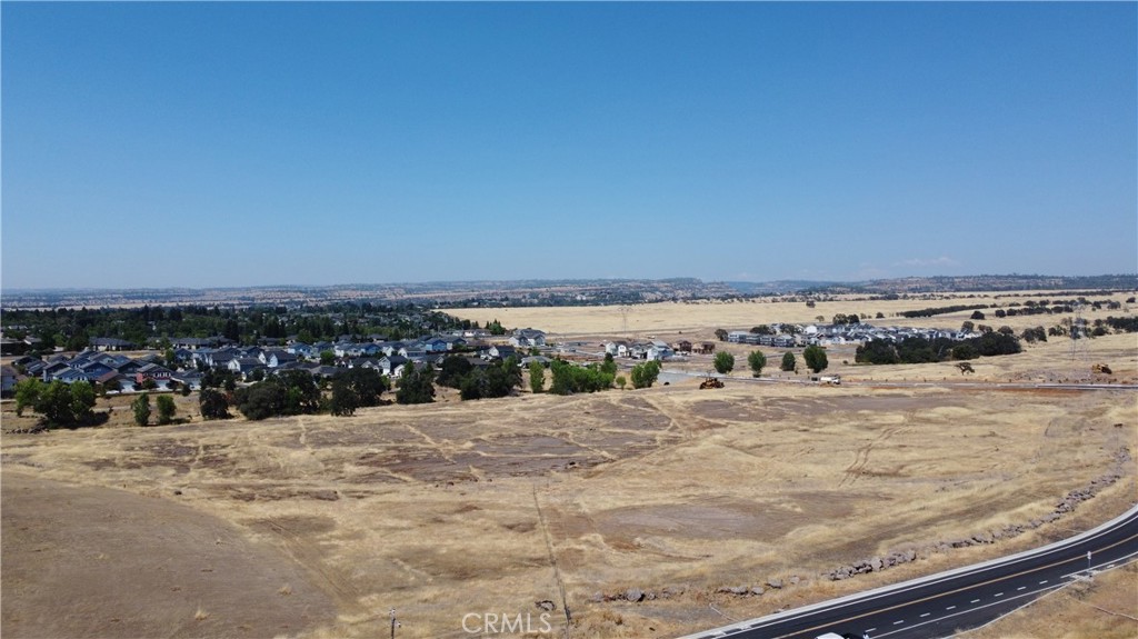 This is a prime 2.34 acre lot in a prime area of commercial development with Native Oak Dr, Yosemite Dr and Humboldt Rd surrounding the property. The parcel has been subdivided with improvements recently completed including road, curb, gutter and utilities in the frontage, the road has also been extended across the creek. This is a site ready for development next to several other completed projects. Neighboring projects include DR Horton's Sparrow community of 86 homes, Oak Valley subdivision, Lava Ridge Apartments, and other multi-unit projects in the final phases of construction. The property has been subdivided to this final acreage with senior housing planned on the adjacent parcel to the West/South West. This parcel is zoned R2 - Medium density with an allowable density to 14 units and focusing on housing for development compatibility with Chico's general plan. Beautiful location with approximately 2.2 miles to services like Target, Winco and more.