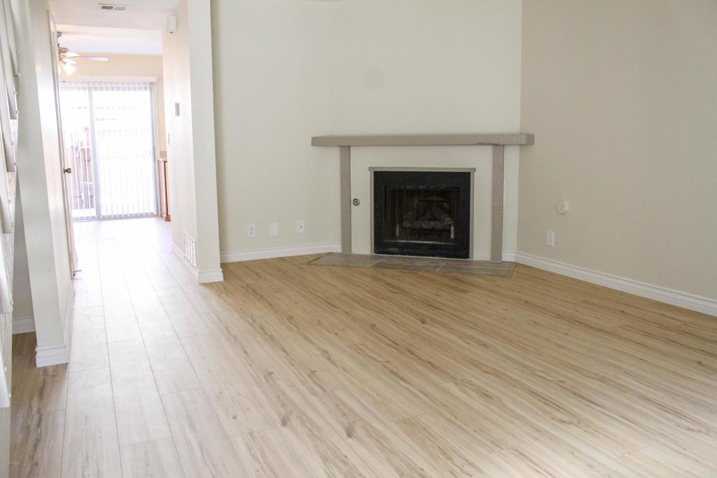 Warm and Inviting 2 Bedroom 1.5 Bathroom Townhome in a quiet, 12 unit complex located just a short distance from the beach. This two story townhome features new wood-like floors and carpet, kitchen with brand new stainless steel stove, refrigerator and microwave, dining area, half bath downstairs, living room with fireplace, full bath upstairs, and two spacious bedrooms. Large outdoor patio off of the kitchen/dining area. This home is cooled by ocean breeze.Utilities not included.Please, no pets.