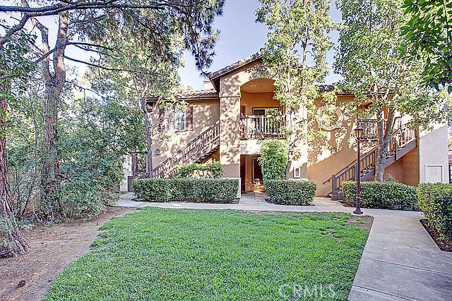 This highly sought after upper level 2 bedrooms, 2 baths, Rancho Veracruz home (master suites) has it all! Desirable floor plan offers both bedrooms comparable in size. This model is so private, overlooking a large greenbelt. The floor plan has open concept living room with separate dining room and family/living room. Newer hardwood laminate flooring offering a rich and luxurious upgrade. The outside patio is spacious and perfect for family gatherings. This home also comes with built-in laundry area, cozy fireplace, built-in microwave, dishwasher, newer stove and a two-car garage. Close to shops and restaurants, 2 resort style association pools, spas, clubhouse, fitness center, low HOA dues which include water and trash. Included are the refrigerator, washer and dryer! Hurry, this home will not last long!