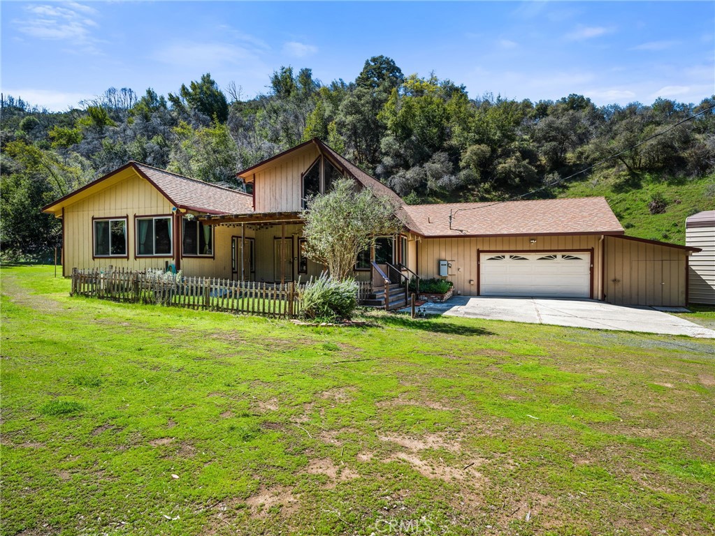 Classic Country Home offers a spacious and comfortable living environment with soaring beamed ceilings. The home features three bedrooms, two bathrooms, and a versatile loft area. Set on an expansive 39-acre property, the residence is ideal for those seeking tranquility and ample space. The property includes a flat pasture, perfect for horse enthusiasts, rolling hills for hunting, target practice, and two wells ensuring a reliable water supply. Additionally, two electrical meters provide flexibility for various uses. Recent updates to the home include newer double-pane windows, a roof and gutters, fresh exterior paint, recent remodeled kitchen featuring leather finished granite countertops and custom backsplash, enhancing both energy efficiency and aesthetic appeal. A Generac generator offers peace of mind with backup power during outages. For recreational vehicle owners, the property boasts covered RV parking, safeguarding your vehicle from the elements.