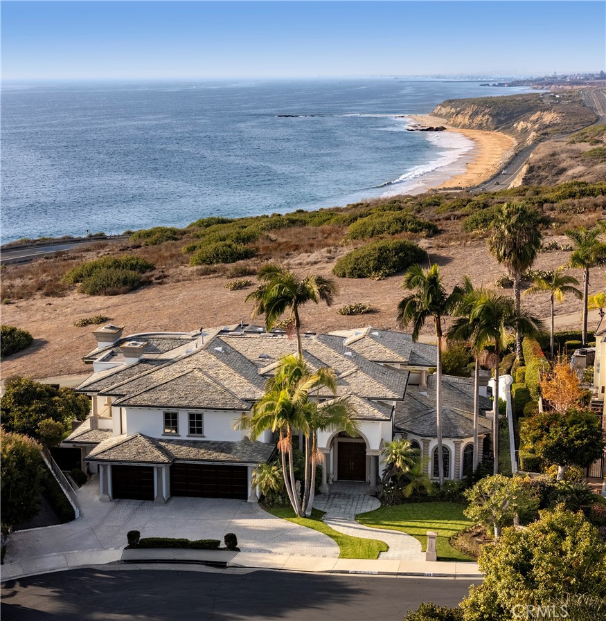 Located in the prestigious, gated, and patrolled community of Irvine Cove, nestled in breathtaking Laguna Beach. This stunning residence combines timeless elegance with modern convenience, offering 4 bedrooms and 5 bathrooms in a serene coastal setting. Within the residence discover a sophisticated traditional aesthetic, adorned with fine walnut and stone appointments throughout. The warm, wood-paneled office is perfect for working or relaxing in style, while the formal and informal living spaces, each with its own fireplace, create an inviting ambiance for entertaining or quiet evenings at home. The heart of the home is a beautifully designed kitchen, featuring all-new appliances, a charming breakfast nook, and ample space for culinary creativity. A thoughtfully designed laundry room provides exceptional storage and functionality. The large master suite is a private retreat, boasting unobstructed ocean views past Laguna’s rolling hills, along with luxurious his-and-hers bathrooms for ultimate comfort and privacy. Completing the home is a spacious three-car garage to meet all your storage and parking needs. Within the community, Irvine Cove residents enjoy exclusive access to a private beach, ample guest parking, and proximity to preserved hiking trails. This property can be offered fully furnished and includes a golf cart and golf cart garage. The location offers unmatched convenience, just moments from world-class shopping, dining, John Wayne Airport, the performing arts center, and much more. Don’t miss the opportunity to reside in a piece of coastal paradise in one of Southern California’s most coveted oceanfront communities.