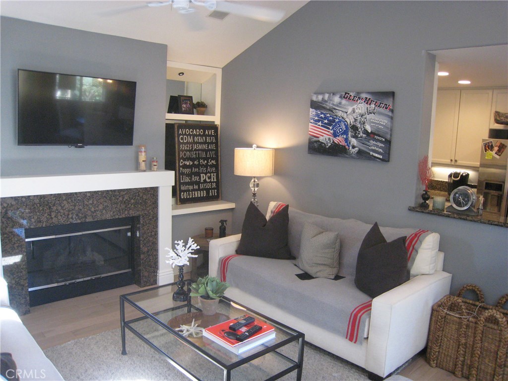 Come enjoy the resort lifestyle of Trovare on the famed Newport Coast. Well-planned 2 bedroom high upgraded condo now available for lease. Open floor plan with high vaulted ceilings and plenty of sun-filled windows. Customized with beautiful wood floors throughout, plantations window shutter and shades. Living room with cozy fireplace open to dining area and kitchen. Kitchen has a full complement of stainless top of the line appliances as well as granite counter tops. Nice master suite with high ceilings and fully upgraded bath with walk-in closet. Large outside balcony open to living room, dining room and master suite. Premium corner unit in quite area. Spacious 2 car garage with tons of storage cabinets, epoxy floors and laundry area with washer and dryer. Trovare residents enjoy resort amenities which include, association pool and jacuzzi, as well as exclusive membership in Coastal Canyon Club with Olympic salt-water pool, staffed clubhouse, catering kitchen, lighted tennis courts, sport courts. World-class Fashion Island and Crystal Cove shopping and dining.