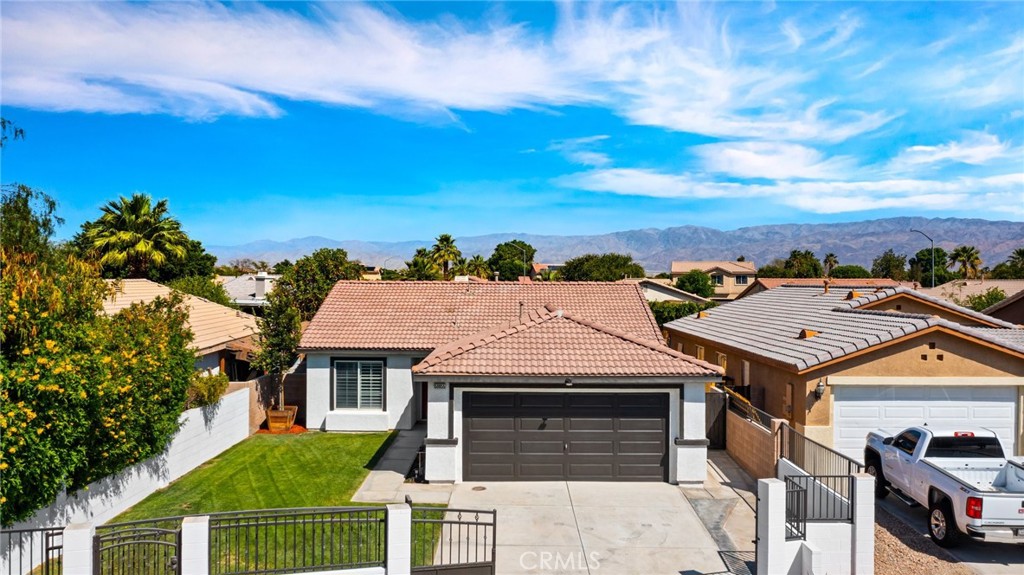 Welcome to 50855 Chiapas Dr, a beautifully updated home located in the heart of Coachella. This charming 3-bedroom, 2-bathroom residence offers 1,256 square feet of living space and has been thoughtfully upgraded throughout. The home features fresh exterior and interior paint, interior recessed and exterior lighting and new baseboards creating a clean and modern look. The kitchen has been renovated with freshly painted and refaced cabinetry, sleek solid countertops and stainless steel appliances, and new hardware and lighting with a functional layout that’s perfect for both everyday living and entertaining. The bedrooms are ample in size for your comfort. The restrooms have been remodeled for your convenience offering new counter tops, lighting and hardware. The living room offers a newly refaced fire place for those cold cozy nights. Step outside to a spacious backyard oasis with a newly installed pool and stunning hardscaping ideal for enjoying the warm Coachella weather. There is a covered patio shade and added privacy, making the out door space perfect for relaxation and gatherings. Whether you are a first time buyer or looking for a move in ready home with tasteful upgrades, this property delivers great curb appeal, style, comfort and value. Located near local schools, parks, and shopping centers with convenient access to major roads. Don't miss this great opportunity and schedule your private showing today.