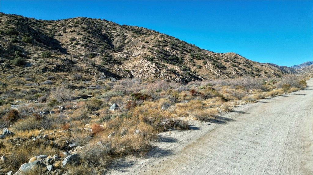 Price Adjustment: $40,000!
5 Gorgeous Acres with a creek in the Canyons of Morongo Valley CA. The property is nestled up against the hills of Big Morongo Canyon! The San Bernardino and San Jacinto mountain views are expansive and everywhere you look. Desert views at night are the lights in the lower desert and that begins with Palm Springs CA. Higher elevation at this property affords you cooler temperatures in a remote and private setting. It's quiet, tranquil and peaceful here. Those of you who are hiking enthusiasts will find your Zen at this property, you just have to see it to believe it.. Property is conveniently located about 30 minutes to Joshua Tree and about 25 minutes to the Palm Spring areas for fine dining, entertainment and shopping galore. Build your dream home here or your "desert retirement getaway". The water/ creek runs through this property seasonally as the photos show. During summer months temperatures exceed 100 degrees so it will depend on rainfall during winter, spring and fall and even then, it probably will be dry, it's desert land. The perfect location to build is beyond the creek. Property is on a high water table so should you drill for a well, you could hit water less than 30 feet down. There's two power poles in the vicinity for electricity. This spectacular land is priced to sell! Don't hesitate, come have a look now this can be yours. The directions will take you to the property and the sign at the same time. We're accepting all offers!