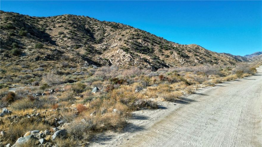 Price Adjustment: $39,000!
5 Gorgeous Acres with a creek in the Canyons of Morongo Valley CA.  The property is nestled up against the hills of Big Morongo Canyon! The San Bernardino and  San Jacinto mountain views are expansive and everywhere you look. Desert views at night are the lights in the lower desert and that begins with Palm Springs CA. Higher elevation at this property affords you cooler temperatures in a remote and private setting.  It's  quiet, tranquil and peaceful here.  Those of you who are hiking enthusiasts will find your Zen at this property, you just have to see it to believe it..  Property is conveniently located about 30 minutes to Joshua Tree  National Park and about 25 minutes to the Palm Spring areas for fine dining, entertainment and shopping galore.  Build your dream home here or your "desert retirement getaway".  The water/ creek runs through this property seasonally as the photos show.  The perfect location to build is beyond the creek.  Property is on a high water table so should you drill for a well, you could hit water less than 30 feet down. There's two power poles in the vicinity for electricity. This spectacular land is priced to sell! Don't hesitate, come have a look now all of this can be yours.  The directions will take you to the property and the signs. We're accepting all offers!