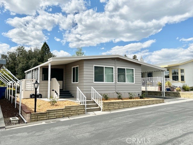 Like New!!! Welcome to Valencia Lea, Highland’s premier +55 community! This 2/2 1973 AMER 1040sqft home has great curb appeal, with new paint, new dual pane windows, new landscaping, new roof coating and a large sunporch! This 2 bedroom, 2 bath home features new paint and new durable luxury vinyl plank flooring. The large open living and dining areas have plenty of windows, with new window coverings, letting in tons of natural light, and built-in dining room cabinets. The upgraded kitchen features new maple butcherblock counter tops, stainless sink/faucet, and new European style stainless steel appliances! Just off the kitchen is a second eating area with laundry area, perfect for informal living. The guest bedroom has a walk-in closet and nearby guest bathroom features tub shower combo with granite vanity top. The large primary bedroom features his and hers walk-in closets and attached spacious bathroom with glass enclosed low-threshold shower. The large back yard with mature orange tree features mature plantings with enough open space left to make it your own. The full-length carport includes storage shed. Don’t delay in taking a tour!