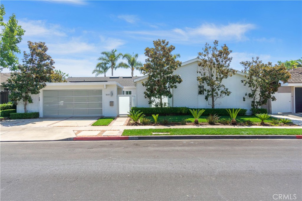 Exceptional opportunity to own a recently renovated single-story home in the prestigious Irvine Terrace neighborhood, offering luxury living at its finest. Step into an expansive, open-concept design enhanced by high-end finishes and modern upgrades. The property features four spacious bedrooms plus a versatile den, three beautifully remodeled bathrooms, and a saltwater pool with a removable safety gate—perfect for both relaxing and entertaining.
A private courtyard leads to the main residence, while a separate guest casita offers its own entrance, complete with a fully equipped kitchen and living area, ideal for guests or extended family. The living spaces are defined by soaring beam ceilings, clerestory windows, and seamless indoor-outdoor flow, with a striking fireplace and masonry accents adding warmth and character.
The chef’s kitchen, bathed in natural light, boasts quartz countertops, premium stainless-steel appliances, custom cabinetry, and a large breakfast bar—perfect for casual dining or hosting gatherings. Additional features include solar panels (leased), central air conditioning, sleek vinyl floors, and a modern frosted glass roll-up garage door.
While the home is livable and was recently renovated, its 1960s build reflects the charm of a previous era. In line with a growing trend in this highly desirable area, many homeowners have chosen to purchase similar properties, completely demolish them, and build their dream homes. This offers an incredible option to create a custom residence in one of the most sought-after locations in the world.
Positioned in a coveted location near Irvine Terrace Park, this high-end lease offers access to Corona del Mar’s finest amenities, including upscale shopping, gourmet dining, and pristine beaches. Experience elevated coastal living in this exceptional residence.