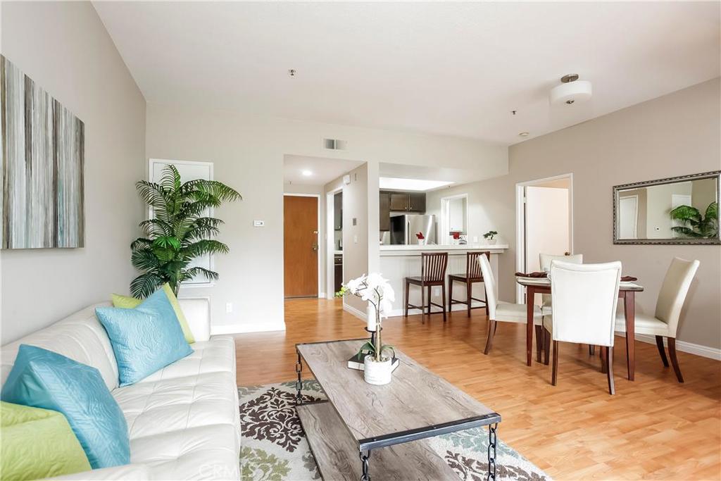 Enjoy the amenities of the Windermere on the Green complex! This large gated condominium complex offers a gated security entrance, pool, lap pool, spa, clubhouse, gym, racquetball, ping pong table, bbq, and more! Located just minutes from old town Torrance, and the Del Amo shopping center, and the Wilson Park Farmer’s Market, with easy access to the PCH. Come home to this cozy turn-key unit, take a break on the large balcony, entertain friends in your open concept living /dining room; or enjoy some quiet time by the fireplace in your den/ office area. You will love all of the storage space in this galley style kitchen, equipped with newer appliances, dishwasher, and lots of light! The private master offers dual closets and an attached master bath. And the separate half-bath powder room off from the living room is perfect for guests. The inside laundry room gives this unit the convenience you need! Other upgrades include new paint and lighting throughout! This unit is a true gem, at an unbeatable price!! Come see it today!!