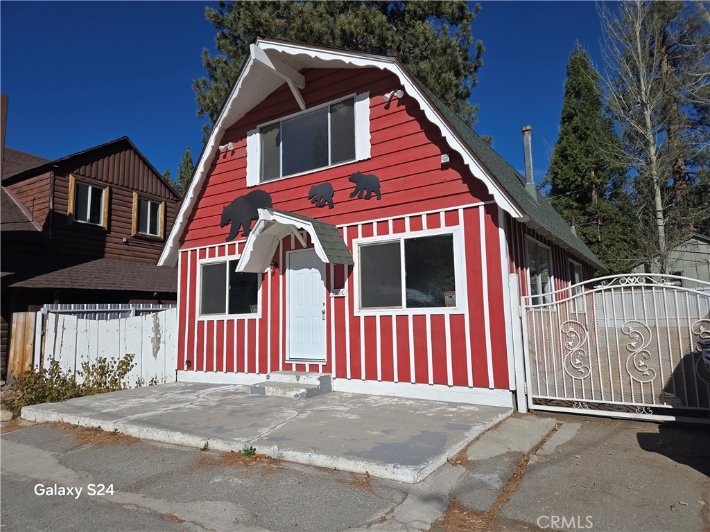 Downtown Fawnskin. The property can be used commercially or residentially. The sellers have a rebuild letter from the county for single-family residences, which was required for their VA loan. New interior paint and flooring. Open spacious floorplan. Street to alley lot. Rear-fenced yard and access. Totally level. Walking distance to everything in Fawnskin Village, including Grout Bay, the National Forest, the Lake, The Moose Lodge, Restaurants, the Market, and the Merchantile. Has been an engineering office, a real estate office, and a home. It's a perfectly level lot. Two window air conditioners, Owners will consider a lease option and/ or 1031 exchange for rental property in Las Vegas. The loan is an assumable VA loan