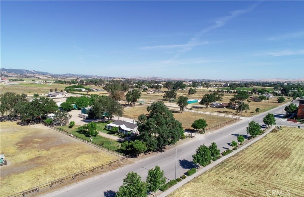 POTENTIAL REDEVELOPMENT (COMMERCIAL/INDUSTRIAL/RETAIL) INVESTMENT OPPORTUNITY and/or TURNKEY EQUESTRIAN CENTER???
10.23 acres located in a prime area of Paso Robles, California and minutes from the airport and downtown with easy highway access; both north and south, as well as to the Central Valley. Currently, this pristine property is set up with a premier horse facility consisting of barns, 50' round pen, covered sheds, arena, wash racks, mare motel and numerous turnouts and pastures with shelters. Included is a 60'x 30'+/- shop, covered RV parking and a newer 1400'+/-, 3 Bedroom/2 Bath manufactured home with decking in front and back that overlooks the beautifully landscaped grounds. This property is adjacent to a fast growing area of Paso Robles comprised of retail, commercial, industrial and residential developments. Investment, income property, possible redevelopment...IMAGINE THE POSSIBILITIES!!! Seller is willing to consider offers asking for concessions!