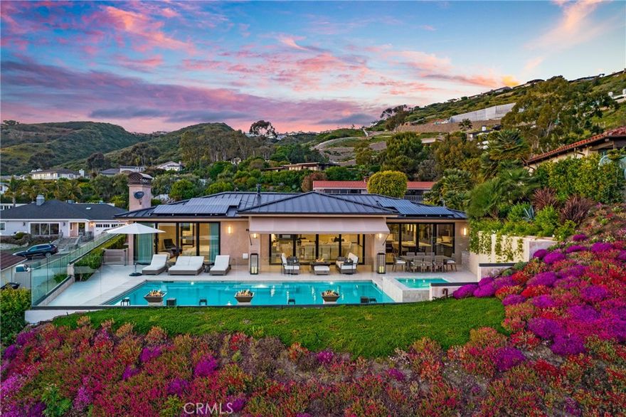 Truly an outstanding opportunity for this meticulously maintained ‘single level’ ocean view, Custom Residence within the Coveted “Ocean Close Community of Monarch Bay Terrace”. This ‘soft contemporary’ home offering exceptional privacy, magnificent ocean views, & an enviable open and spacious floor plan is situate on a spacious & manicured 10,000+sqft site & contains 4 bedrooms, 3.5 baths, app. 3247 sq ft, & a stunning ‘resort like’ entertaining rear yard with a covered salt water pool & spa! The owner has invested over $200,000 in upgrades during his tenure! Additional amenities include a ‘Quartzite’ slabbed center island ‘gourmet kitchen’ with ‘Wolf’ microwave, warming drawer & oven, gas cooktop, range & ‘Subzero’ refrigerator, as well as a walk in pantry & ‘Vortex’ reverse osmosis system at kitchen sink , indoor laundry room with built in safe, wine bar, central air conditioning, surround sound, tankless water heater, ‘Life Source Premium’ whole house water purification system, upgraded ‘Crestron’ home system, security system, solar system, custom cabinetry, accent lighting. The ’ocean view’ Master suite is inclusive of dual vanities, walk in shower, free standing soaking tub, custom privacy glass, ‘Toto’ toilet, custom walk-in closet, direct access to laundry room, stacked tile fireplace, ocean view & a direct access to the ‘resort style’ rear yard containing the ‘infinity edge’ spa. Two of the ancillary bedrooms are ensuite & the fourth bedroom is currently used as a home office. The ‘resort like’ rear yard contains a covered patio area, 4 fire features perfect for evening entertaining & ambiance, separate ‘Lynx’ BBQ & grilling station, wading pool for children, ‘infinity spa’, & pool, as well as front yard privacy fencing and manicured landscaping with custom lighting and irrigation. The attached 3+ car garage is totally finished with an epoxy floor and numerous built in shelving and racks. This impeccable ‘Single Level Residence’, with its modest soft contemporary appearance is absolutely a must see for the most discerning Purchaser! This is an ‘11’ on a ’10 scale!! Located within minutes of both The Waldorf Astoria & Ritz Carlton Resorts, as well as walking distance to the ‘Salt Creek ‘Beach with its world-renowned surfing breaks, Monarch Beach Golf Course & walking to the beaches of the Pacific Ocean. Equally close is Dana Point Harbor with its Lantern District as well as numerous shopping & dining establishments. This is truly a 'Must See'!
