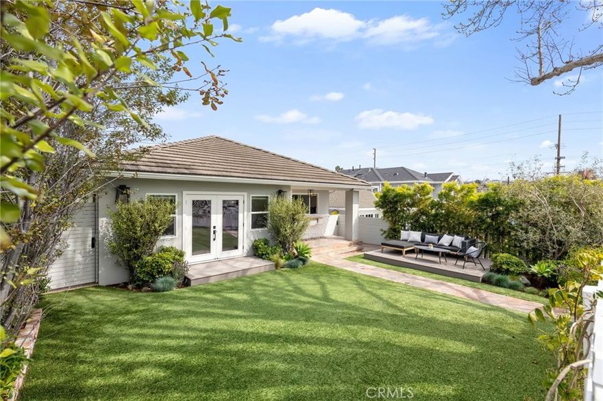 Sitting on the Avenues behind a charming white picket fence, this effortlessly cool beach bungalow with a finished ADU is the ultimate coastal retreat, blending laid-back luxury with classic South Redondo charm. Step inside this thoughtfully designed 3-bedroom, 2-bath home, where open-concept living meets effortless style. The expansive great room seamlessly extends to the outdoors through French doors, filling the space with natural light. The living and dining areas flow together for a spacious yet inviting feel—perfect for everything from cozy nights to entertaining with ease. Outside, the fully turfed front yard and private patio provide the ideal setting for relaxing, dining, or enjoying the fresh coastal air. Practicality meets style in the thoughtfully designed kitchen, combining modern and organic elements with knotty pine ceilings, white cabinetry, and pristine quartz countertops. Premium appliances complete the chef’s dream space, which include sa breakfast nook, walk-in pantry, and a laundry/mudroom with a sink, built-in desk, and outdoor access—ideal for post-beach cleanups or weekly organization. The primary bedroom is a private sanctuary with a walk-in closet, en-suite bath, and direct backyard access. Outside, the reimagined backyard is an entertainer’s dream, with a raised deck, firepit, built-in bench seating, and hanging chairs, all surrounded by lush landscaping. What sets this property apart from all the others lies behind the main house - a beautifully remodeled 2-bedroom ADU with the converted garage offering vaulted ceilings, a kitchenette, and a spacious living room. This ADU is the perfect addition—use it as your private office, guest suite, or extra living space. Plus, it comes with its own private backyard and alley access, making it a prime opportunity for rental income. With a few upgrades, you could transform this space into a top-dollar 2-bedroom, 1-bath rental unit that’s fully outfitted and exceptionally remodeled. Whether you’re seeking additional living space or a steady stream of rental income, this ADU offers endless possibilities. Located moments from the beach, top-rated schools, shopping, and dining, this home offers unbeatable coastal living in a vibrant community that values family, friendship,and a relaxed lifestyle. With income potential from the ADU and a move-in-ready design, this beach bungalow is a rare find in one of Redondo Beach’s mos tcoveted neighborhoods.