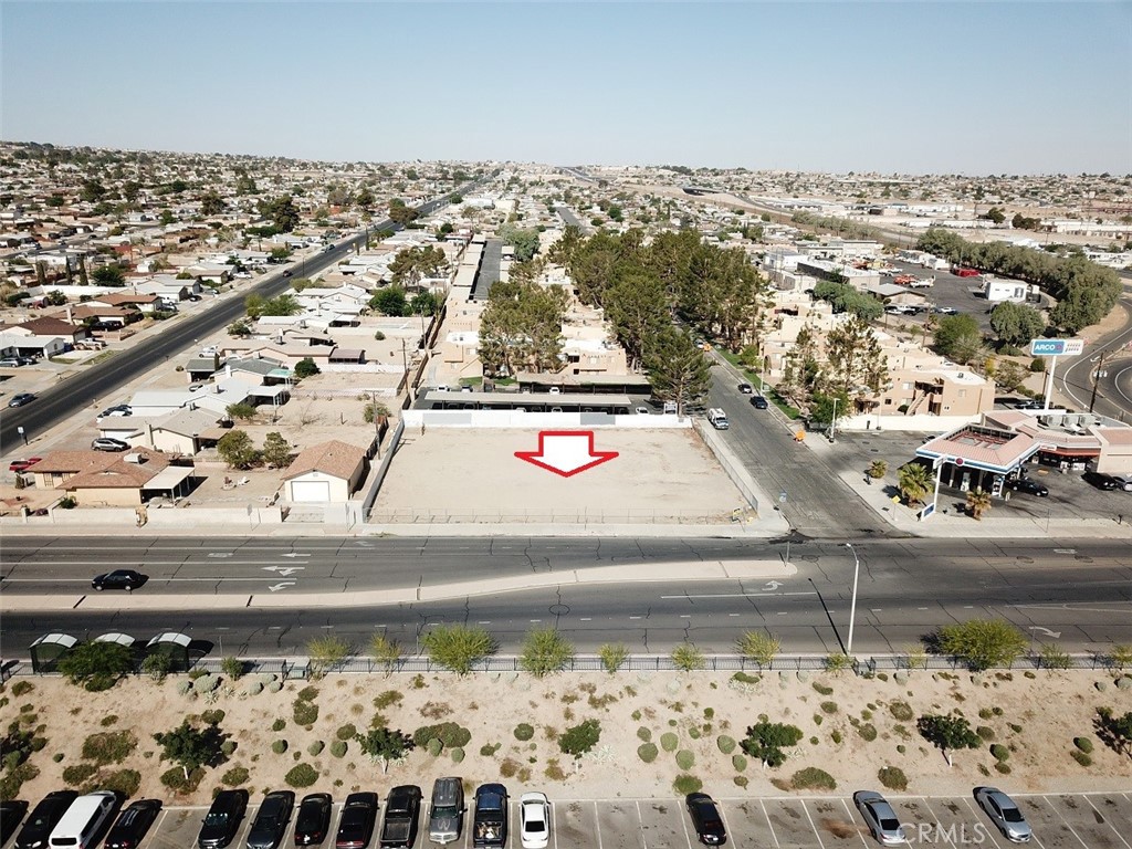 PRICE REDUCED TO $899,000 FROM $1,250,000. Prime Corner Lot. Zoned Commercial use. 19,662 sf. Located across from WalMart, ARCO, and other national retail stores and restaurants. Level lot. Utilities on the street (buyer to verify). APN #0181-541-30-0000. Ideal for fast food drive through restaurant built to suit. Great traffic count.