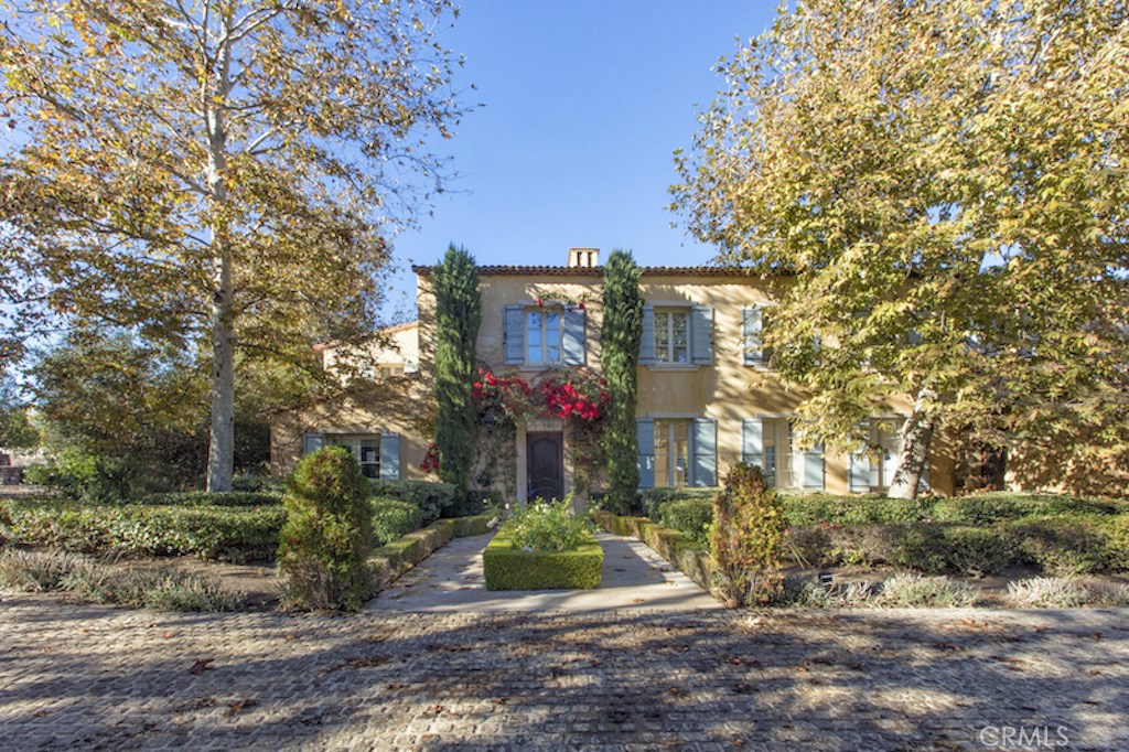 Welcome home to the exclusive golf preserve of Shady Canyon. Anthony Thibert of Maisons has created a master piece by his artistic blending of Old World elegance with contemporary luxuries. Situated on an estate sized parcel, the architect's vision has been executed brilliantly by the very best craftsmen employing time honored techniques while utilizing the finest materials. Of significant note, many features of the home were imported from France, features such as Antique fireplaces, reclaimed roof tiles, timber, and floors all of which may date possibly back to the 17th century. The compound benefits from a fully equipped guesthouse complete with separate parking. The home provides proper accommodations for your live-in staff, and includes a wine cellar, a full bar, theatre and what every serious 17th century French Estate required; a stage. The extensive grounds of approximately one acre plus, includes a large sport field, sports court, cutting - vegetable - herb gardens all of which complement the overall theme of accomodating large gatherings, entertaining and privacy. Note: almost $1,000,000 price reduction, Sellers requesting all offers be presented. Outstanding Value Don't wait. Call now for more information.