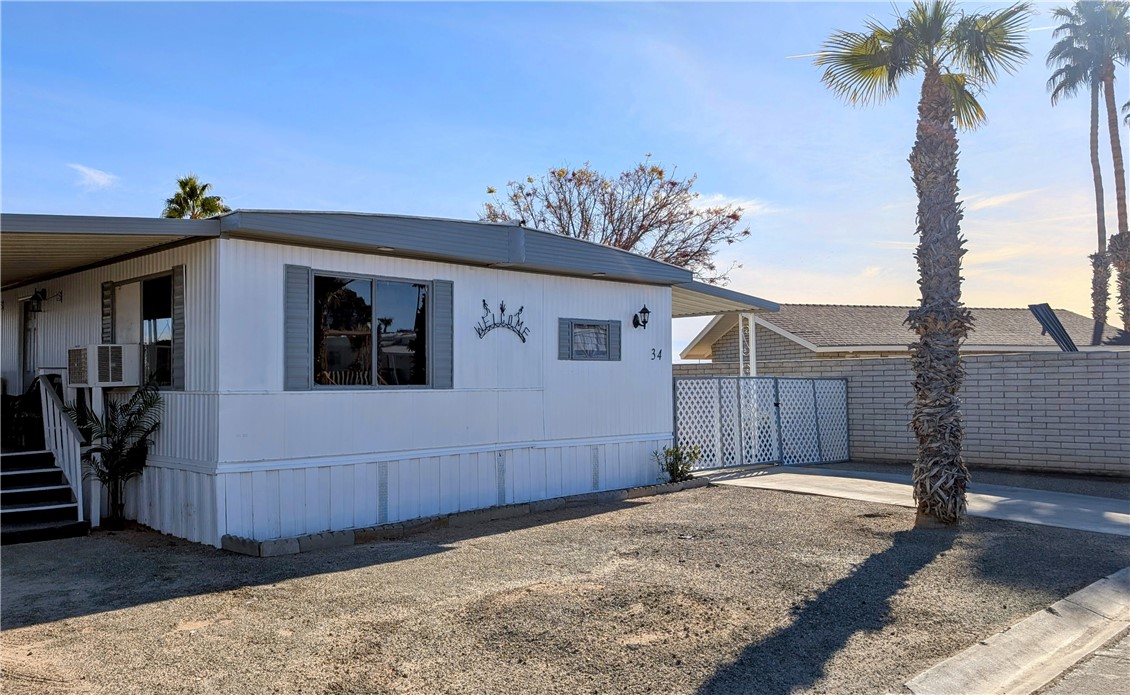 Welcome to your new oasis in Blythe! Ideal for those who appreciate leisure just as much as they adore adventure, this freshly listed manufactured home offers a perfect blend for an enviable lifestyle.
Set in a friendly park environment, this cozy home features two well-appointed bedrooms and one full bathroom. While compact, the space is efficiently designed to maximize comfort and usability without compromising on style. The interior invites you to personalize it and make it your very own slice of heaven.
Step outside the door, and your adventure begins. Whether you're a golf enthusiast eager to practice your swings at the nearby Blythe Municipal Golf Course, a student or educator at Palo Verde Community College, or an outdoorsy type who thrives on desert riding trails, this location doesn't skip a beat. Plus, with the Colorado River just minutes away, weekend kayaking or peaceful riverside picnics could become your new routine.
Feel like staying closer to home? The community itself, while tranquil, pulses with a warm and welcoming vibe, cultivating friendships and daily exchanges of smiles with neighbors.
This delightful abode is more than just a place to rest your head. It’s a gateway to a fulfilling lifestyle, where the serenity of park living meets the thrill of the great outdoors. Fetch your binoculars, riding boots, or golf clubs, and get ready to explore a life where every day is an adventure just waiting to happen!
This property has been recently remodeled from top to bottom and is a must see!
*All buyers must complete a park application and be approved during the escrow process*