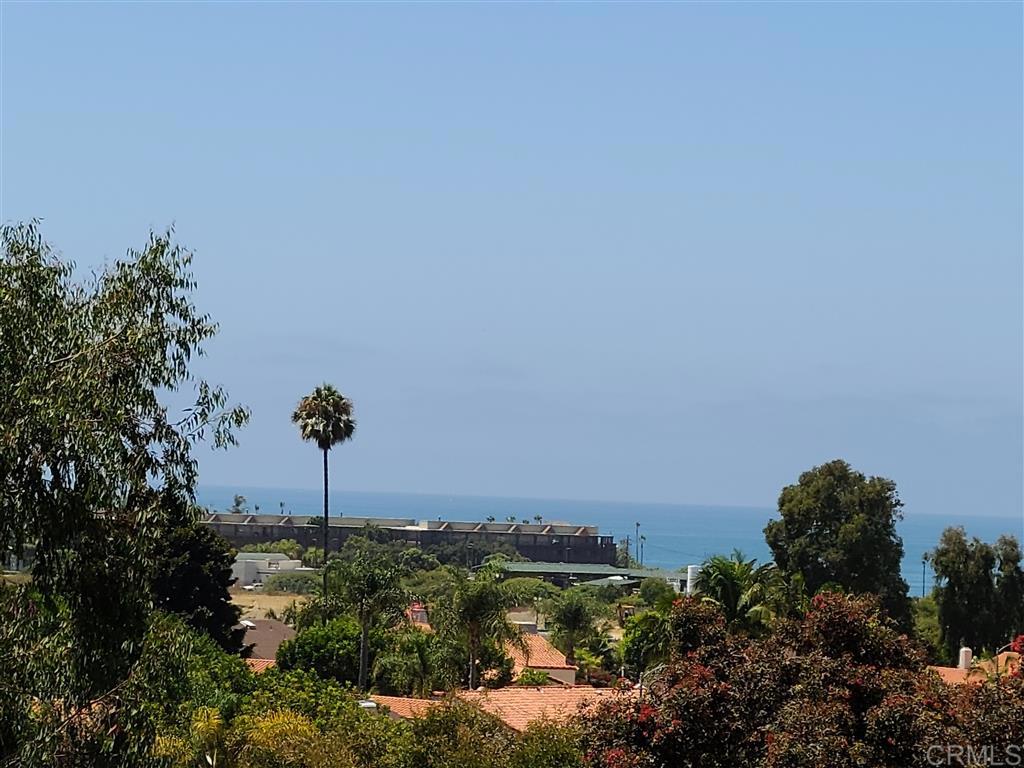 Panoramic Ocean and Sunset VIEWS, coastal breezes. Enter on Main Floor featuring Breakfast Bar Kitchen, Living room, vaulted ceiling, gas fireplace, opens to Balcony for enjoyment of the Ocean/Sunset Views. White Shaker Kitchen Cabinets, new quartz countertop, plank flooring, & fresh paint. 1/2 bath is on main floor. Lower level has two Bedroom Suites & full size Landry closet. No units above or below. A Brisk walk with take you to State beach, outlet shops,Legoland,Flower Fields & a montage of dining.