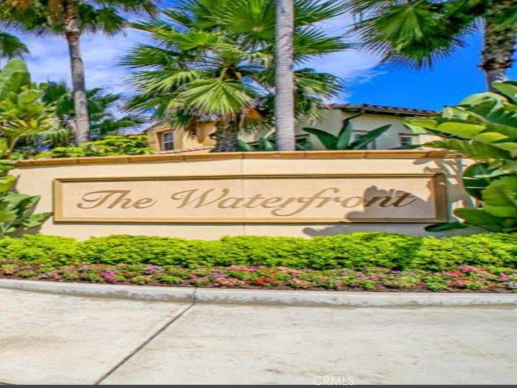 GATED COMMUNITY TOWNHOUSE FOR RENT. This Sea Cove at the Waterfront is highly desirable. It's a quiet end unit with only one common wall and an attached 2 car garage. Gourmet kitchen boasts granite counters and a great island with room for several bar stools. Kitchen includes a refrigerator and comes with a wall oven, microwave, dishwasher and 5 burner gas cooktop. Great room includes a plasma TV on a a full mount bracket, which allows you to watch your favorite TV program or sports team from anywhere in the kitchen/great room. Awesome!! Master suite includes a dressing area with his and hers custom closets and a spa like bathroom with a walk in shower and a large soaking tub. Upstairs also has an office area, a separate laundry room and another bedroom/bathroom suite. Hardwood floors and beautiful wood shutters throughout. Walking distance to Pacific City and literally across the street from the beach. Beautiful community pool, spa and barbecue for you to enjoy. One dog or one cat ok.