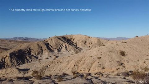 Photo of 1 Buena Vista Drive, 29 Palms, CA 92277 (MLS # PW24224680) Photo of 1 Buena Vista Drive, 29 Palms, CA 92277 (MLS # PW24224680)