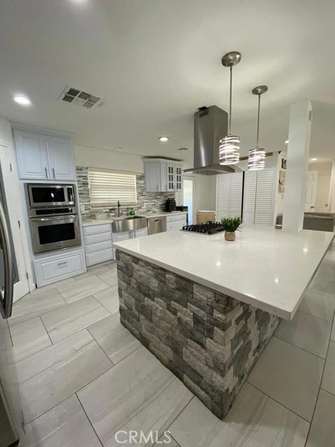 Back on the market! WOW! Don't miss out on this Gorgeous home located in the Los Ranchos family Park. This home has not been spared on upgrades. You will love the open family room to the beautiful kitchen with stainless steel appliances, farm sink and breakfast bar. There is tile flooring, the bathroom has a soaking tub and step in shower with custom rock wall. Don't miss out on this one!!