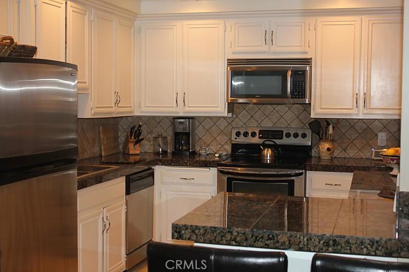 Beautifully remodeled "dual master" condo for rent in Versailles. GROUND LEVEL!!! 2 large Master Suites, 2 full Bathrooms. New showers, granite in kitchen, stainless steel appliances, new dual pane windows / slider, new carpet, crown molding, gated community, pool, spa, clubhouse, gym, and a walk to the beach. 1 parking space in subterranean parking garage (space #34). Additional parking on ground level. Laundry facility located in community parking garage below. (There are not any laundry hook-ups inside the actual unit). Annual lease. Available now!
