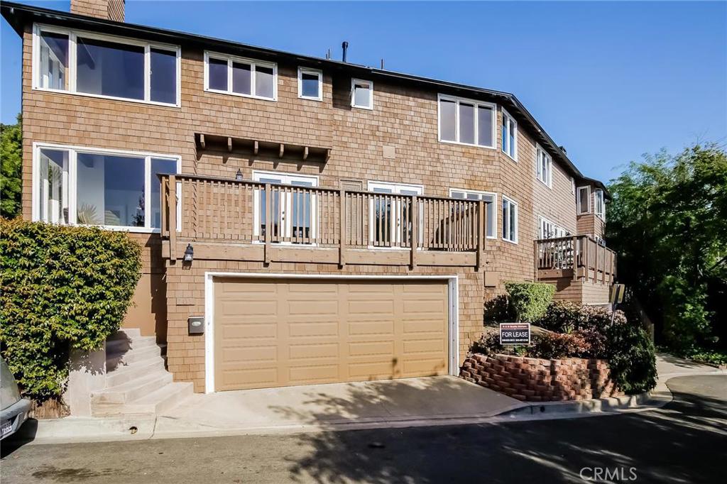 OCEAN VIEW Near the beach. Tucked away on a quiet street within walking distance of the beach, village, restaurants, shops,galleries. Beautifully updated with 4 sets of French doors to bring the outdoors in, sisal carpet,sub-zero refrigerator, stone kitchen counters, cozy sunlit window seat, 2 fireplaces. Large outdoor patio, 2 car garage. Water, Trash and Gardener included.