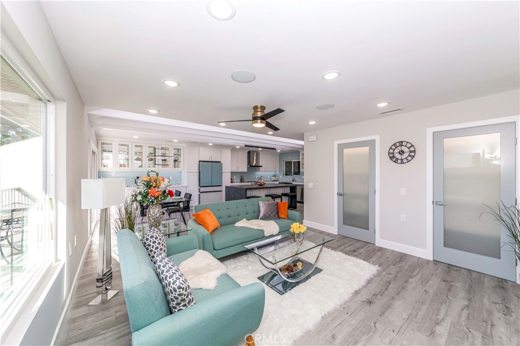 Welcome to this fabulously renovated home in the private Laguna Woods community. This is another exceptional custom designed home with gorgeous open views! This beautifully remodeled house boasts panoramic views of the stunning mountains and city lights. Better than new, this entertainer's dream home was completely remodeled by a renowned architectural design team. It features an open floor plan with a bright and beautiful gourmet kitchen with stainless steel new appliances, oversized island with stone countertops and loads of storage with a walk-in pantry. New flooring, painting and built-in fixtures make it move-in-ready! This home is flooded with natural light throughout from several remote-controlled skylights and solatubes. The custom bi-fold door in the dining area opens up to the beautiful mountain views. The living room features a modern LED fireplace surrounded by lighted glass shelving with a sound console system with ceiling speakers in each room. The SMART home console system enables automatic controlling of the lights, surround music speakers, door-entry system and AC/Heating. Master suite with en-suite bathroom featuring double sinks, a beautifully designed shower and a walk-in closet is a plus! Laguna Wood Village is located less than 8 miles from Laguna Beach and is a quiet, guard-gated 55+community with plenty of amenities for senior residents including 27 holes golf courses and 7 clubhouses. Don't miss this rare opportunity to own a property with incredible views in one of Southern California's most sought after 55+ communities.