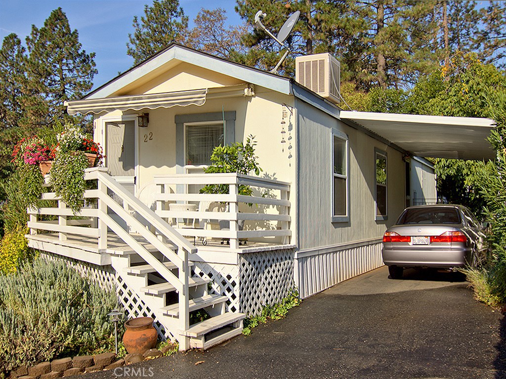 Wonderfully maintained newer mobile home in a 55+ senior community. This park is located in lower Paradise, below Pearson Rd., and is just below the usual Paradise snowline. Upon arrival you'll be happy to see to see the cheerful deck with vibrant blooming flowers and a retractable sun shade awning. Once inside the home, you'll be sure to feel at home with the vaulted drywall ceilings throughout the main living area. These tall ceilings make this space feel much larger, making it easy to have guests while maintaining a small living space. The kitchen provides a gas range and is also equipped with a refrigerator. Down the hall there is a spare bedroom, laundry hookups in hallway (included), and a master bedroom at the end of the hall. This home has an evaporative cooler roof mount, an AC unit in master bedroom, and a central gas furnace for heat. If you're looking for easy Paradise living, look no further!