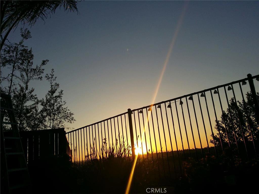 What a TERRIfic Place!! End unit with a Fabulous view. Nice patio area overlooks the green belt with oak trees. Watch the beautiful sunsets or early m morning hot air balloons. No rear neighbors Up to date decor throughout. 3 upstairs bedroom with two baths and an extra space (loft area) for desk or exercise equipment or ? Access to extra storage through ceiling including lights Downstairs has an extra open room too. Great for home business, play room or an overnight guest. Interior laundry room with sink, too !! This unit has a 2 garage and the driveway to go with it. Short distance to the guest parking and amenities. ( pool,spa,playground) Close to shopping and restaurants as well. Places have been selling very quick in this gated complex ! If this is what you are in the market for, don't miss out.. come see it today. Washer, Dryer and Refrigerator to remain. :) Gate code in agent remarks