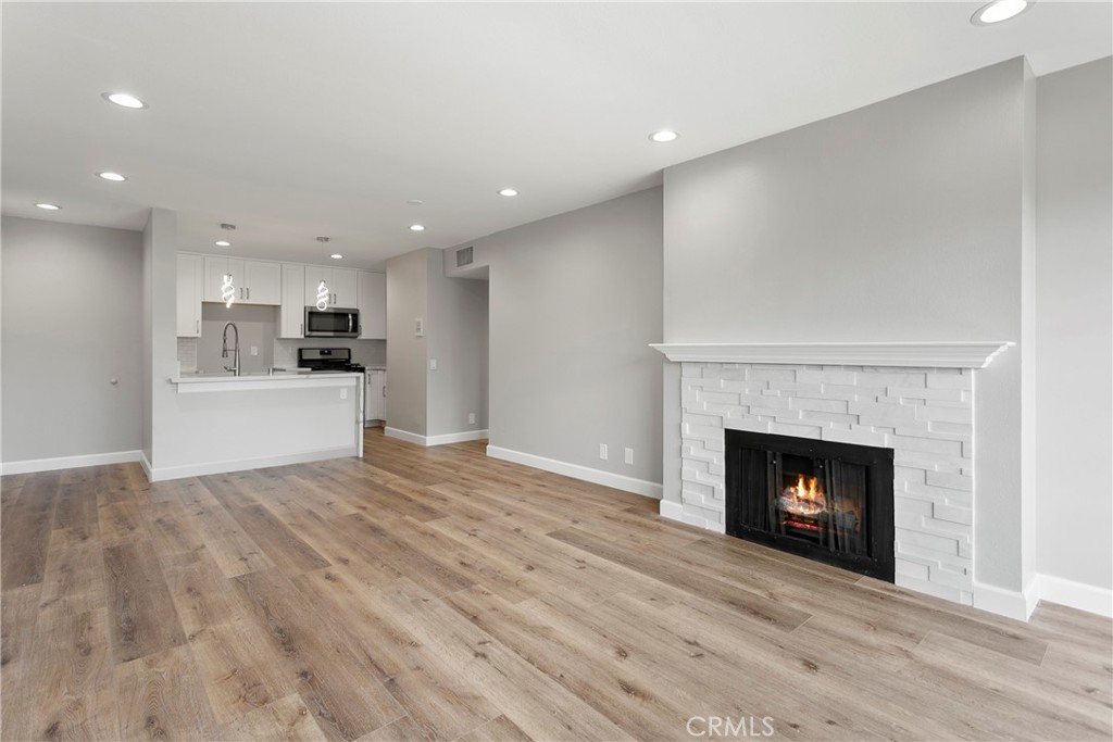 Walk into modern luxury with this absolutely stunning, totally remodeled 2-bedroom St. Albans penthouse condo just steps from South Coast Plaza. Best yet: You won’t believe the price. This floorplan is a favorite for first-time buyers and investors alike, because it’s nearly impossible to find a 2-bedroom with these sorts of amenities (including washer/dryer) at this price range in Orange County. Every detail has already been taken care of with this chic remodel, which means you don’t have to lift a finger when you move in. As you enter, you'll notice the vast and open floorplan. Take in how light and bright this home feels with recessed lighting & luxury vinyl plank flooring throughout, scraped ceilings, and new custom paint. The luxurious kitchen features stainless-steel appliances, smooth-close shaker cabinets, premium quartz kitchen counters with waterfall edge, custom kitchen subway tile backsplash, and on-trend pendant lights. The remodeled bathroom includes a double-sink vanity and washer/dryer, which are rare features at this price point. You have central heating & air conditioning, a huge walk-in closet, which offers plenty of storage space, and a luxurious fireplace, where you can curl up and relax after a busy day. The gated community of St. Albans is one of the premier communities in South Coast Metro, known for its park-like grounds, peaceful atmosphere, and top-notch amenities including two lit tennis courts, two pools, two spas, a gym, and a clubhouse. St. Albans is located within the trendy South Coast Metro area, which is walking distance from world-class shopping, dining, and entertainment available at venues including South Coast Plaza, The Segerstrom Center for the Arts, and others. Bonuses include easy access to the 5/405/73/5 freeways as well as hundreds of employment centers. Indeed, when you live in South Coast Metro, all of Orange County's attractions—including Disneyland and world-famous beaches—are only a short drive away. Act quickly to ensure you can capitalize on this great buy! The community of St. Albans is even FHA and VA approved.